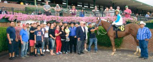 Team Galiana, including breeder John T. Behrendt (blue suit), celebrate the mare’s third Tax Free Shopping victory (photo: Hoofprints, Inc.)